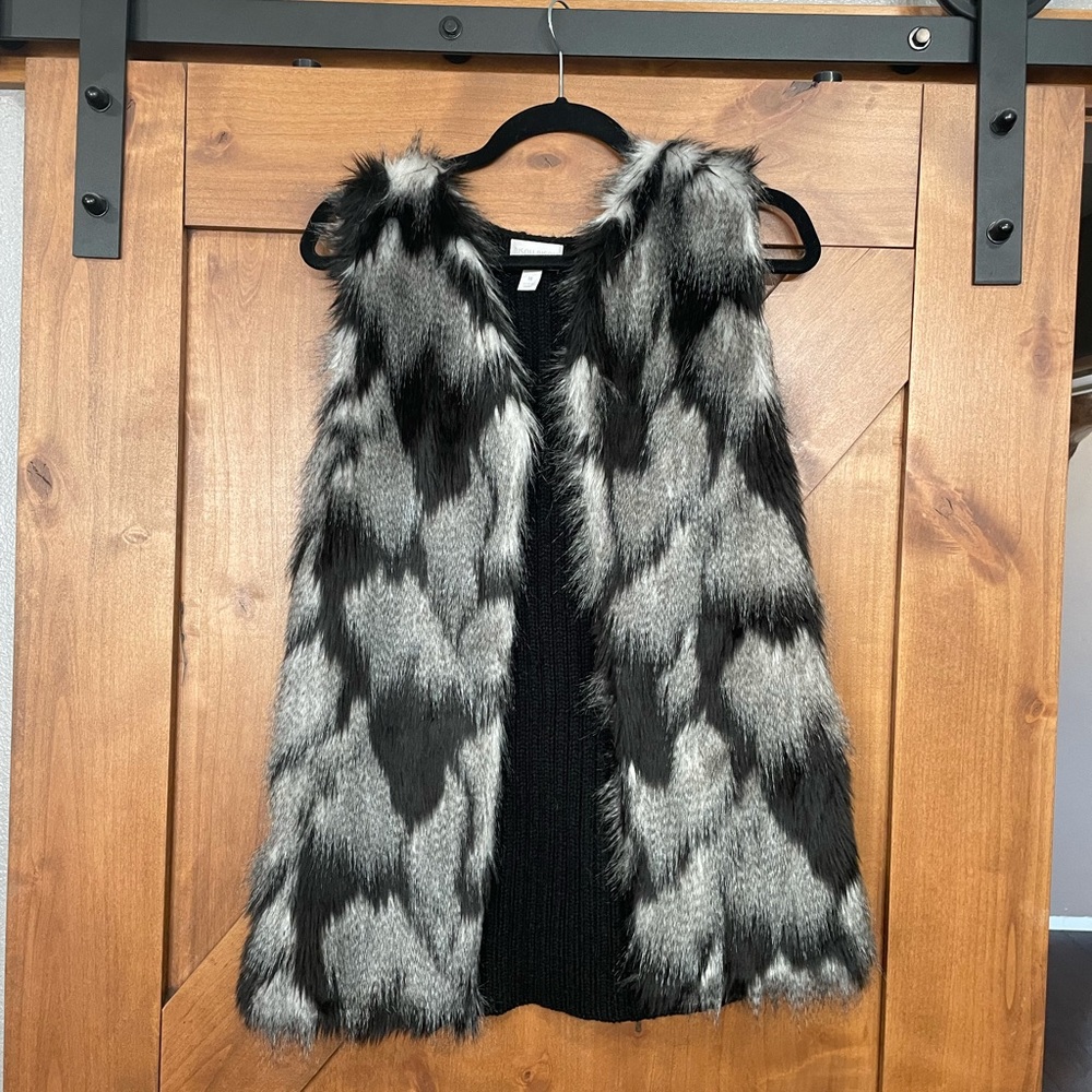 Faux fur vest size medium. New with tags
